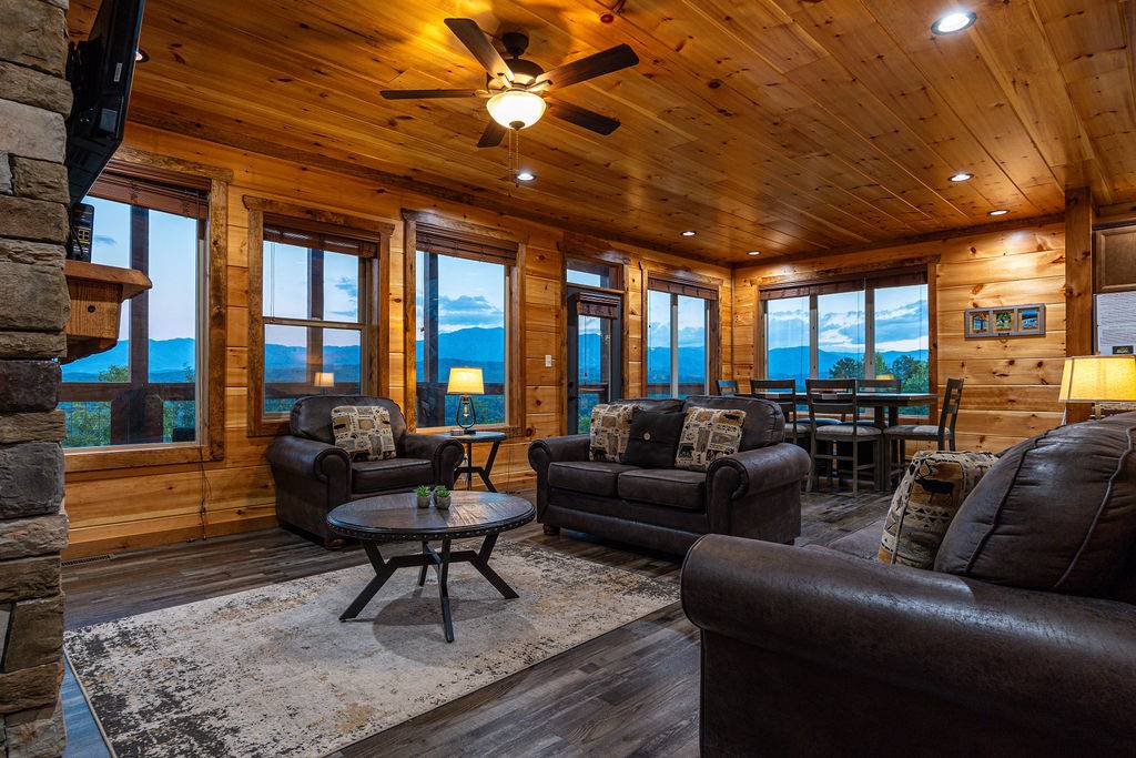 Spacious living room with views, fireplace, TV, and sleeper.
