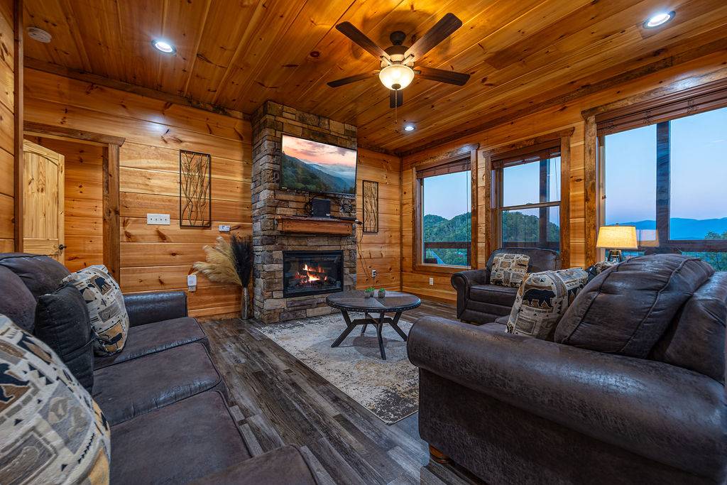 Spacious living room with views, fireplace, TV, and sleeper.