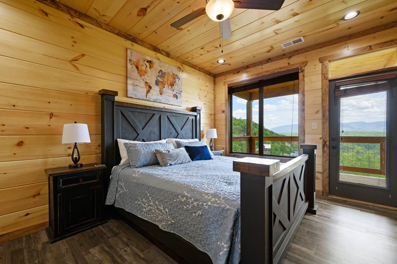 Bedroom 1: Upper level king bed, deck entrance, TV, & bathroom. Bedroom 1: Upper level king bed, deck entrance, TV, & bathroom.