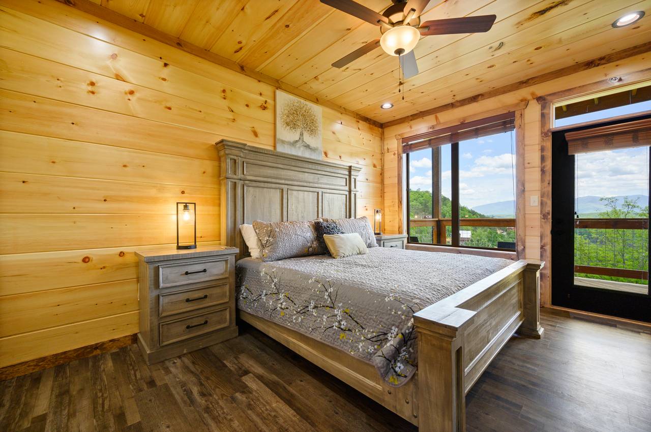 Bedroom 3 on main level with king bed, full bathroom, and deck e Bedroom 3 on main level with king bed, full bathroom, and deck e