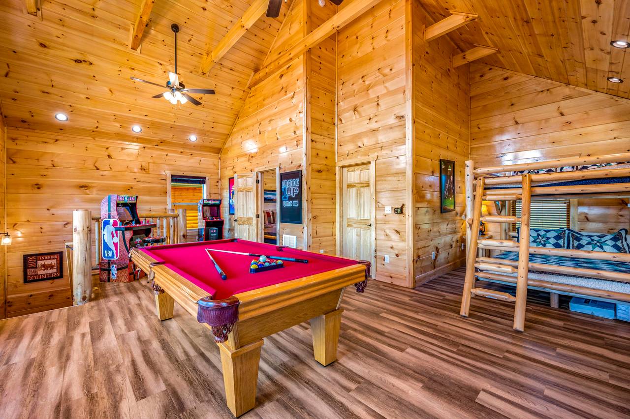 Upper level: Game Room and Queen over Queen Bunk Bed Upper level: Game Room and Queen over Queen Bunk Bed