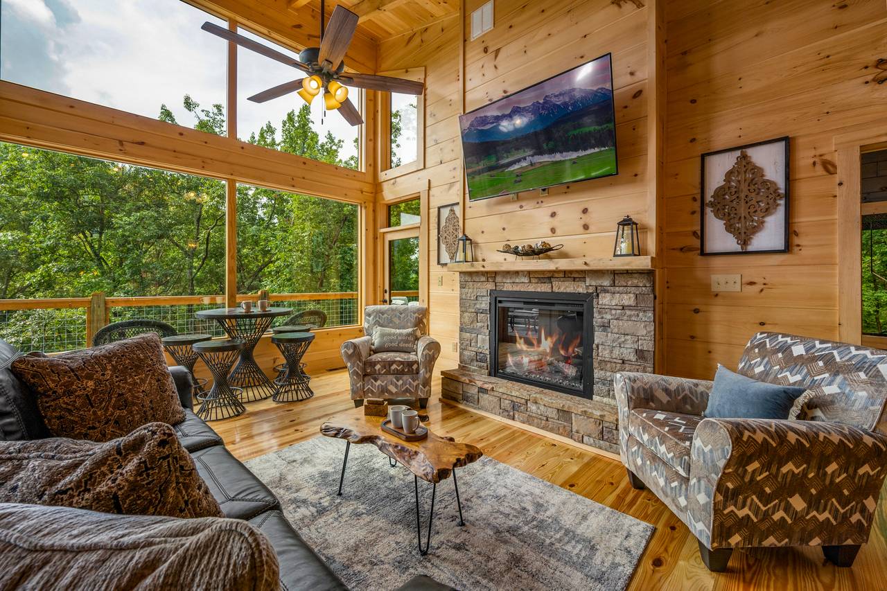 Gorgeous living room with TV, fireplace, sofa, and chair. Gorgeous living room with TV, fireplace, sofa, and chair.