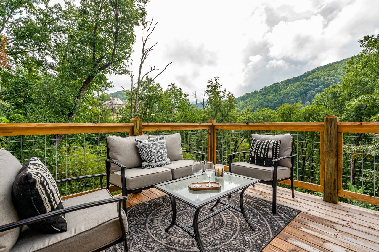 Comfy deck seating with Smoky Mountain views. Comfy deck seating with Smoky Mountain views.