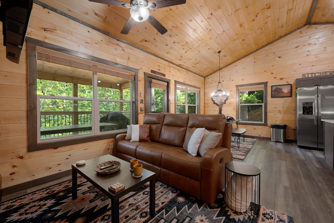 Living room with fireplace, TV, and reclining sofa Living room with fireplace, TV, and reclining sofa
