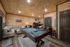 Lower level game room: pool table, arcade, bunk bed & sofa Lower level game room: pool table, arcade, bunk bed & sofa