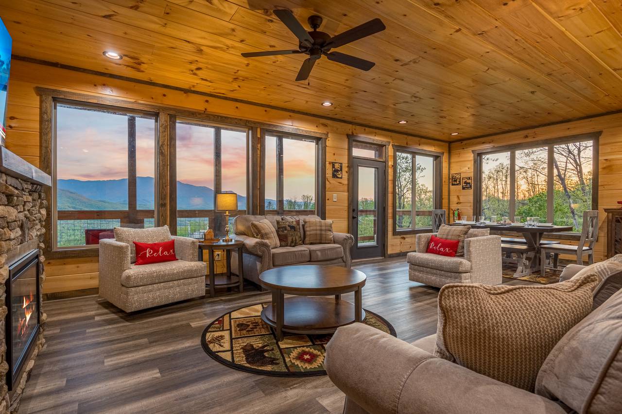 Spacious living room w/ couch, armchair, loveseat, TV & fireplac Spacious living room w/ couch, armchair, loveseat, TV & fireplac
