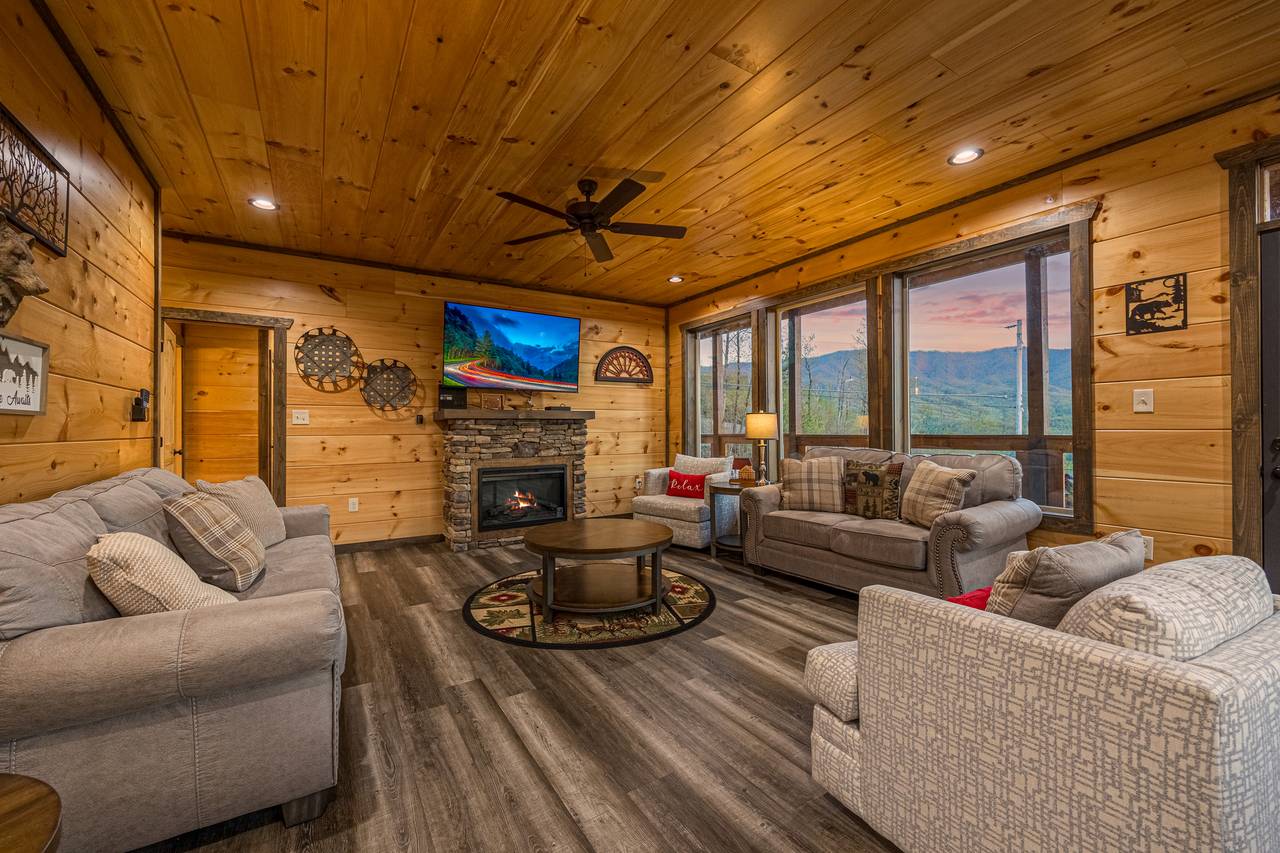 Spacious living room w/ couch, armchair, loveseat, TV & fireplac Spacious living room w/ couch, armchair, loveseat, TV & fireplac