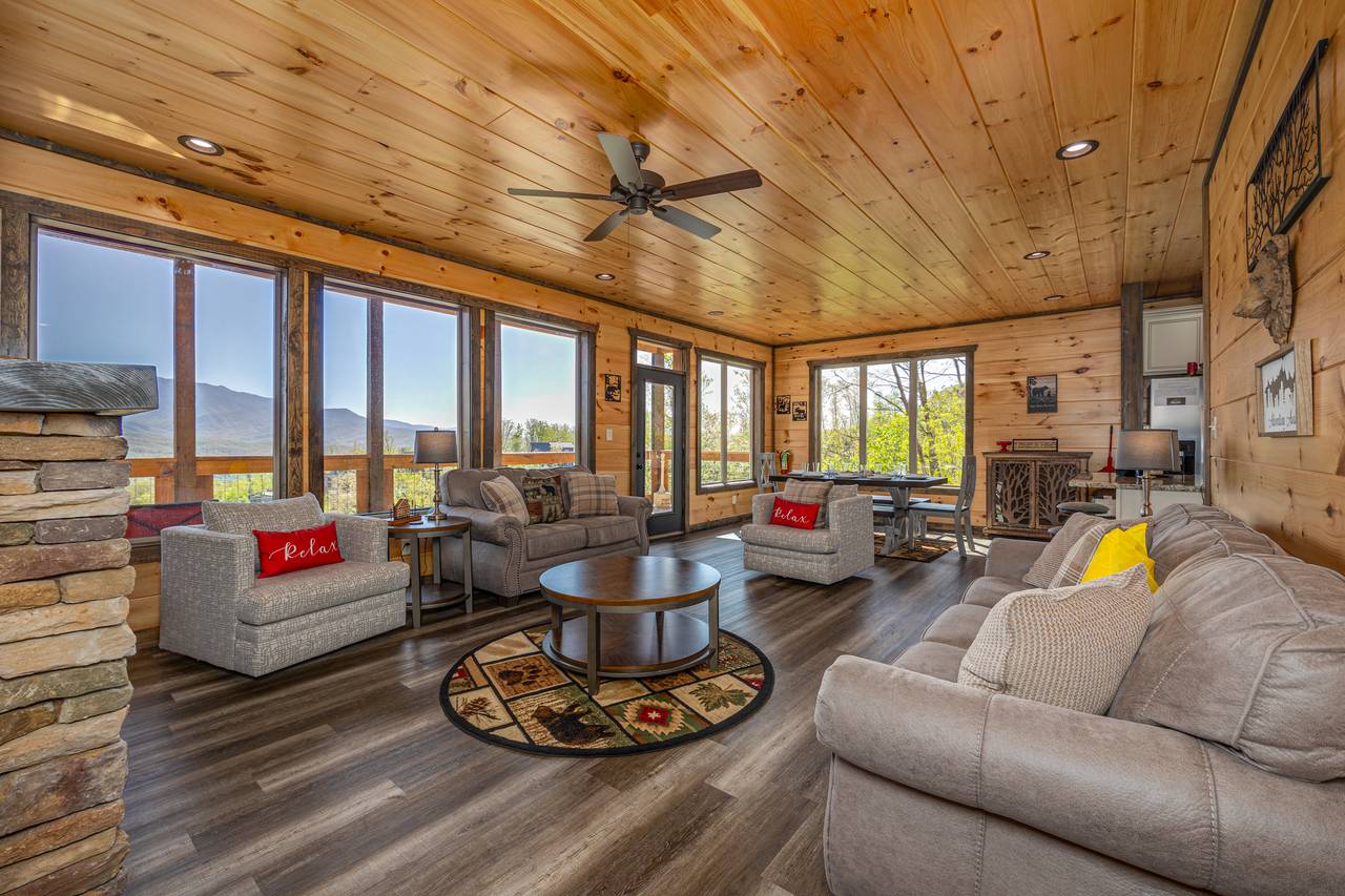 Spacious living room w/ couch, armchair, loveseat, TV & fireplac Spacious living room w/ couch, armchair, loveseat, TV & fireplac