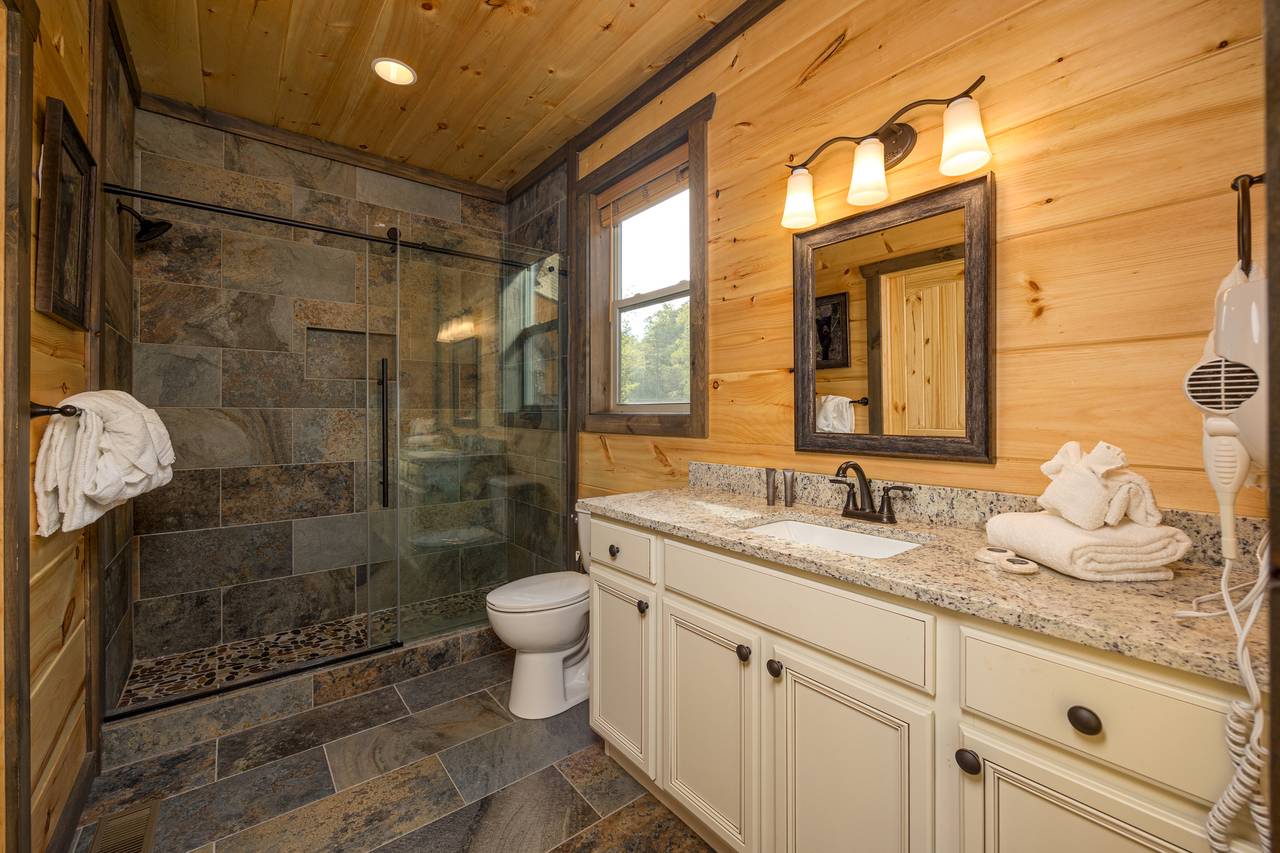 Bath 1: entry level ensuite with dual head shower Bath 1: entry level ensuite with dual head shower
