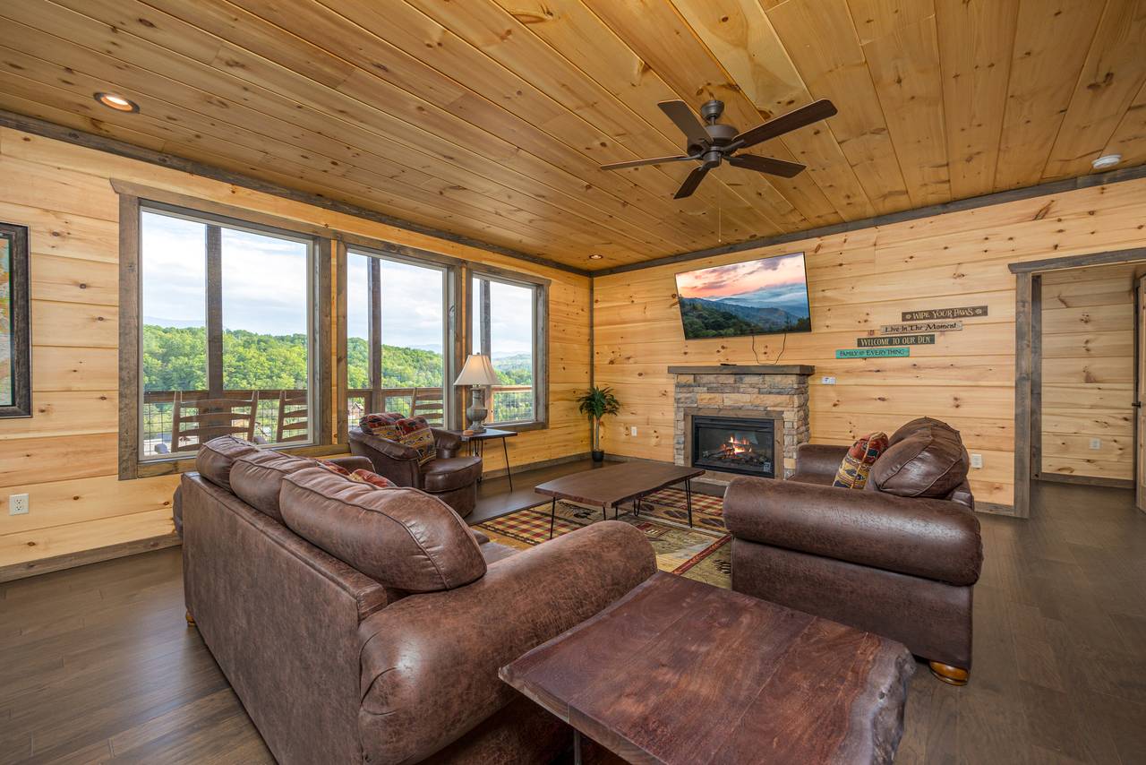 Living room with views, fireplace, TV, & sleeper sofa. Living room with views, fireplace, TV, & sleeper sofa.