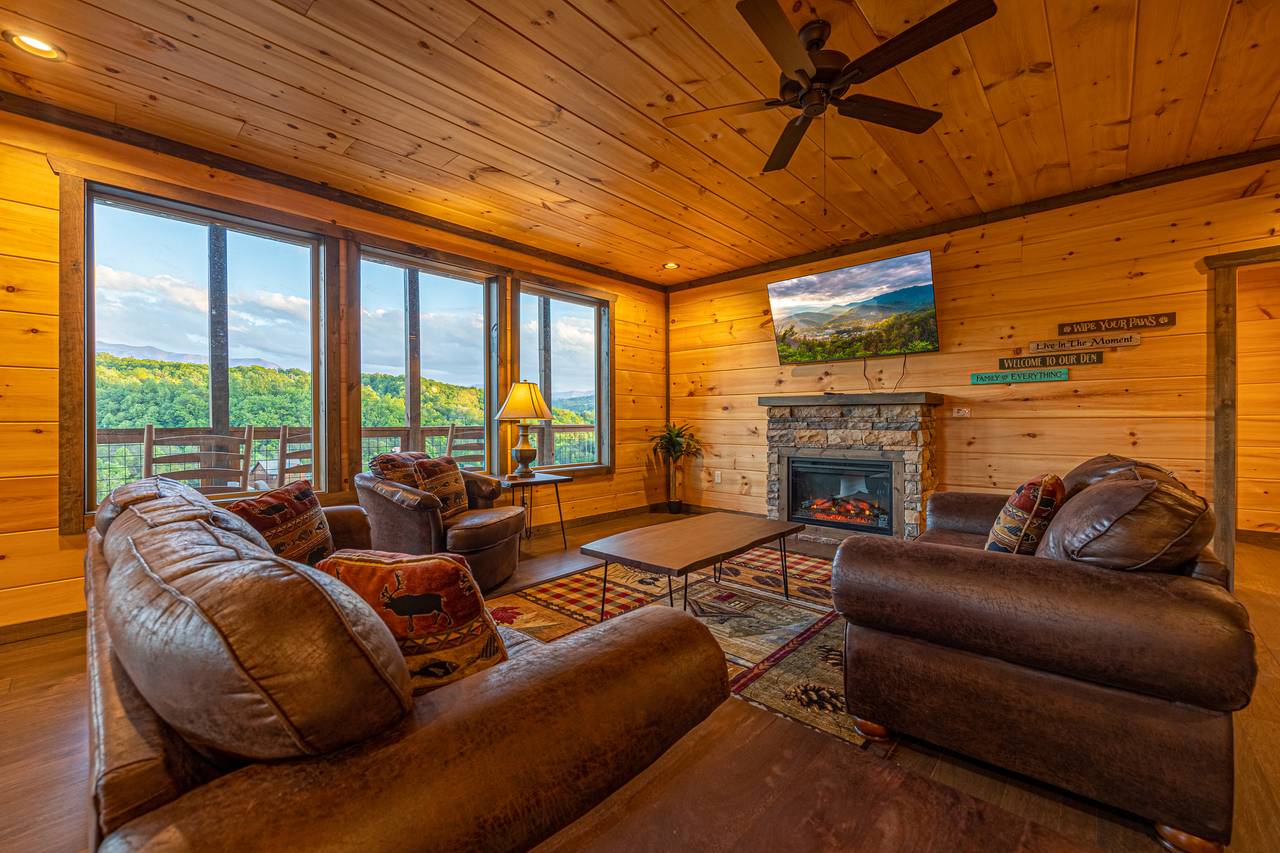 Living room with views, fireplace, TV, & sleeper sofa. Living room with views, fireplace, TV, & sleeper sofa.