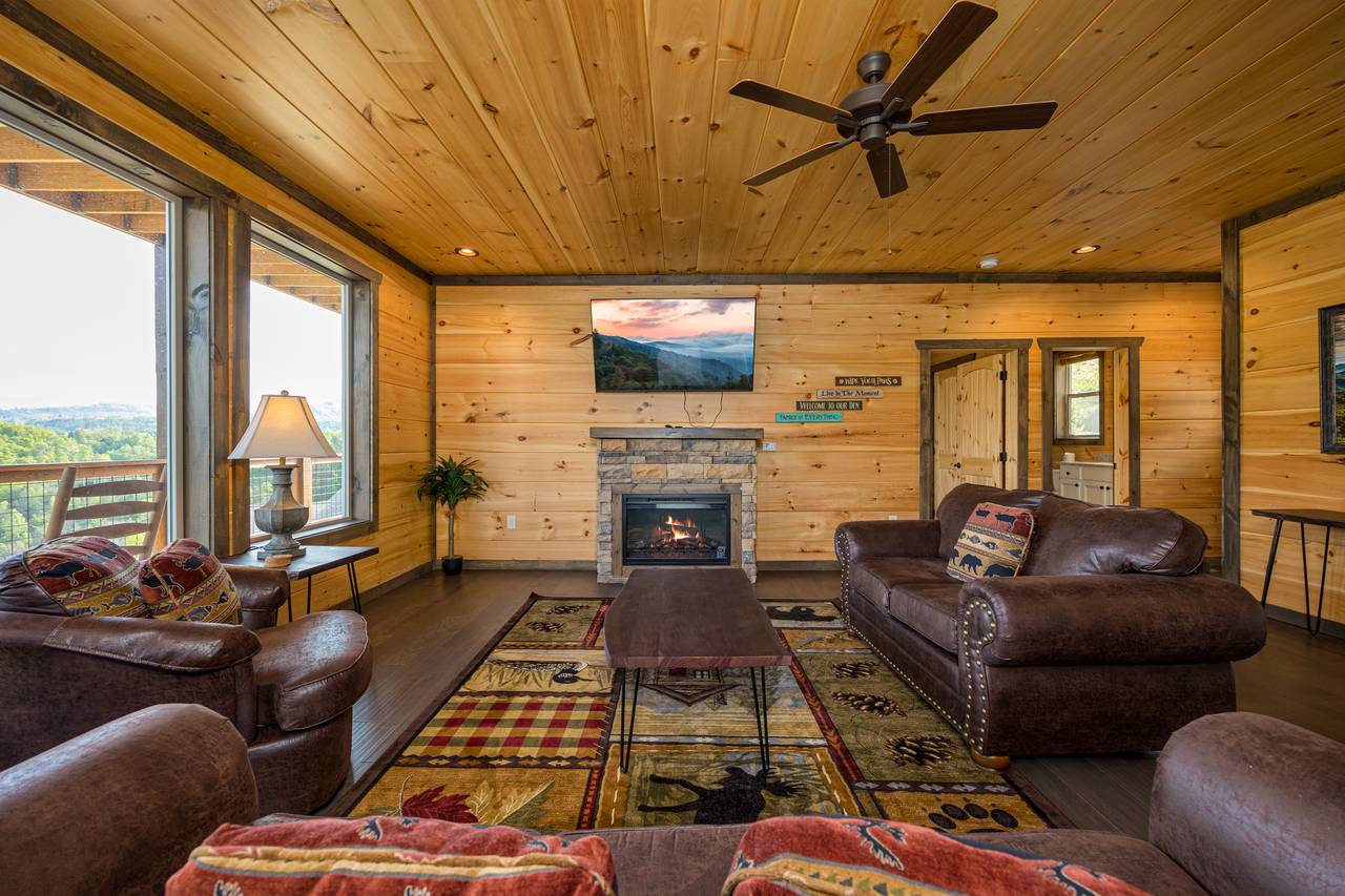 Living room with views, fireplace, TV, & sleeper sofa. Living room with views, fireplace, TV, & sleeper sofa.