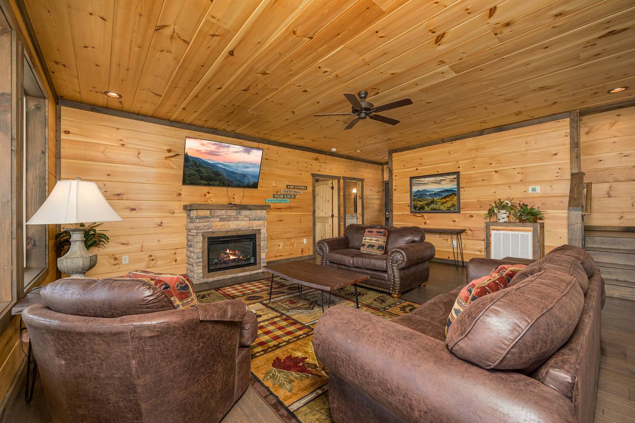 Living room with views, fireplace, TV, & sleeper sofa. Living room with views, fireplace, TV, & sleeper sofa.
