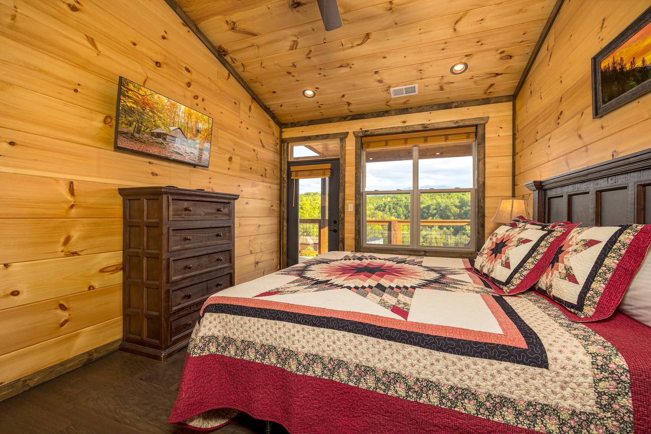 Bed 3: upper level king, TV, ensuite full bath, & deck access Bed 3: upper level king, TV, ensuite full bath, & deck access