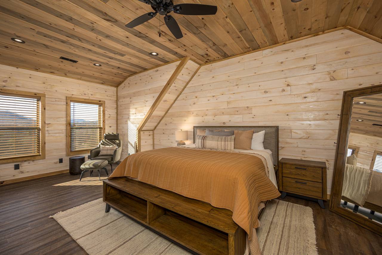 Upper level King bedroom with TV and en-suite full bathroom Upper level King bedroom with TV and en-suite full bathroom