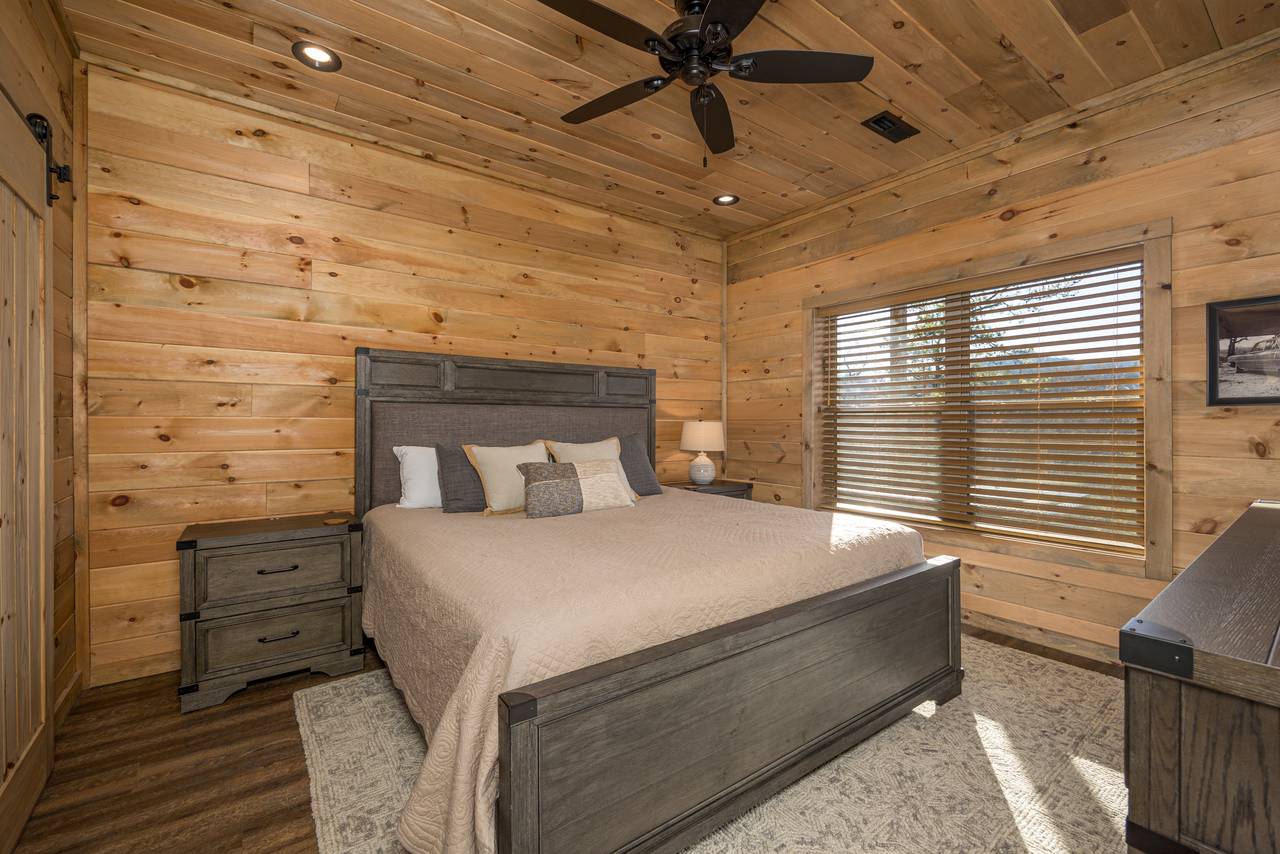 Lower level king bedroom with en-suite full bath and TV Lower level king bedroom with en-suite full bath and TV