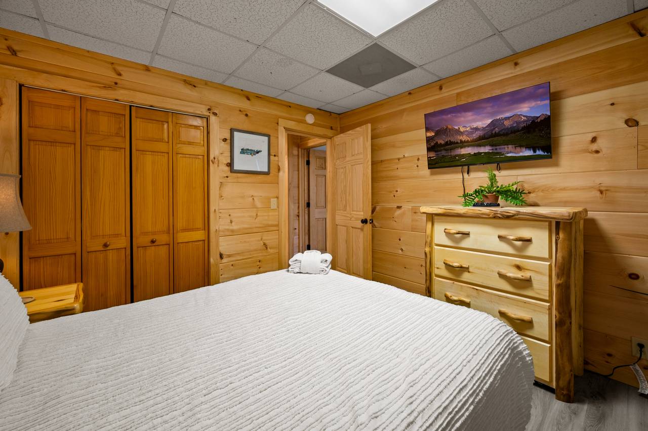 Lower level queen bed with TV Lower level queen bed with TV