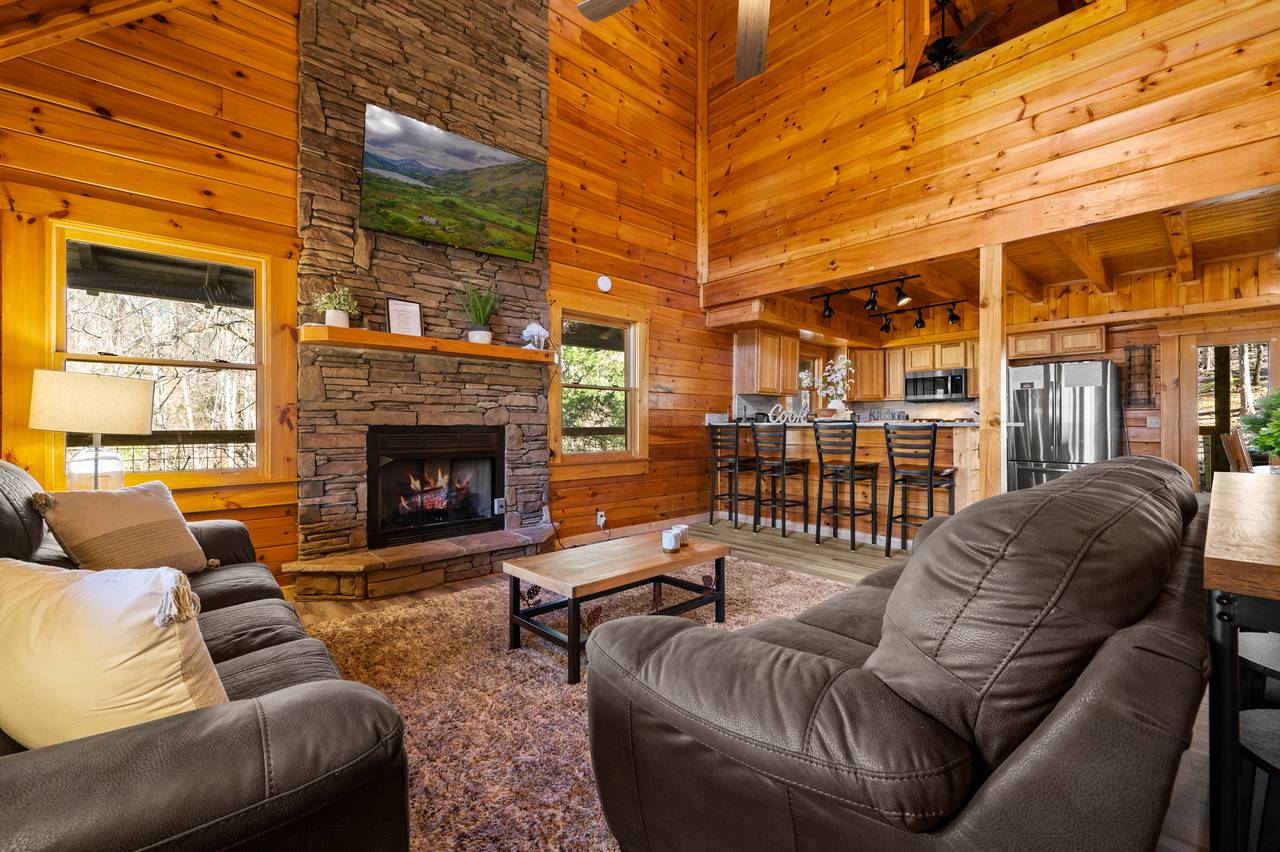 Entry level living room with 2 sofas, TV, and seasonal fireplace Entry level living room with 2 sofas, TV, and seasonal fireplace
