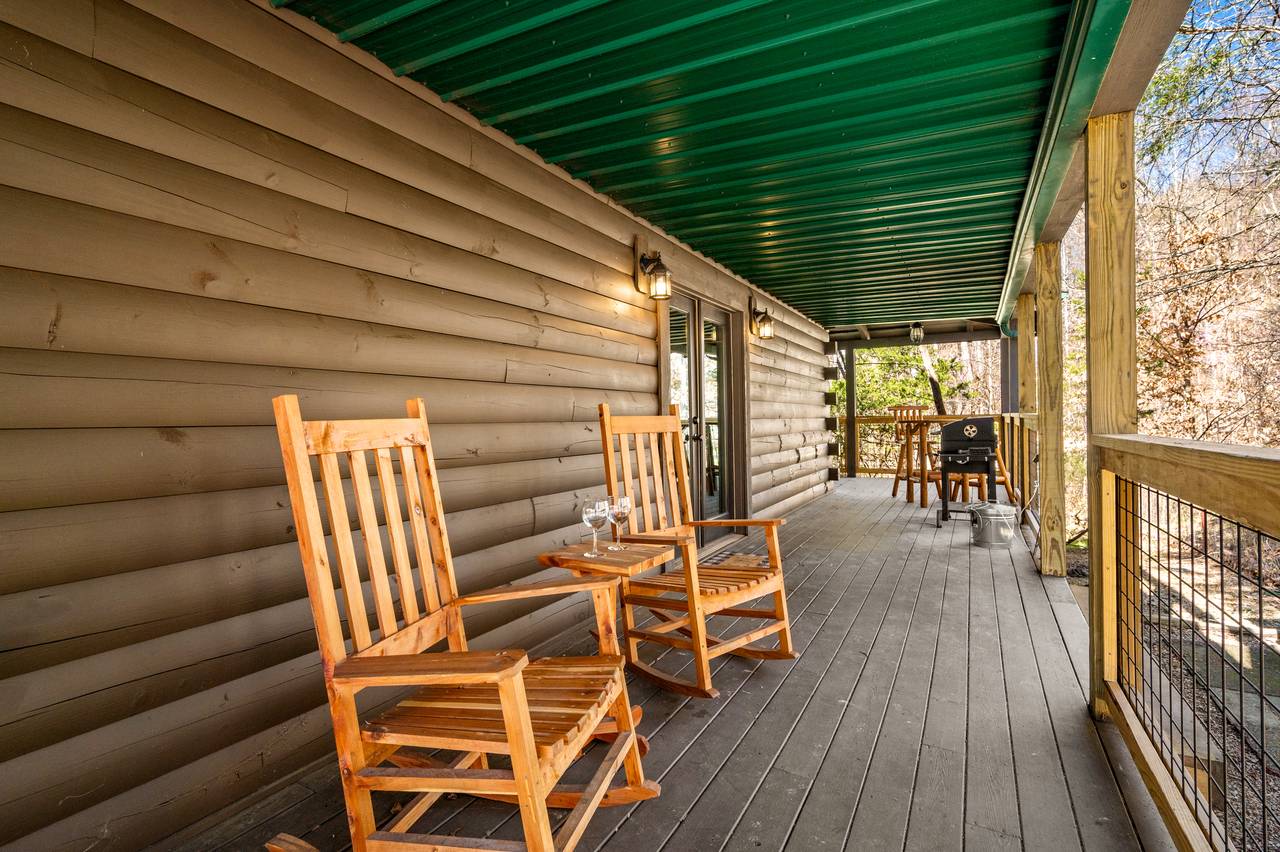 Spacious deck with rocking chairs Spacious deck with rocking chairs