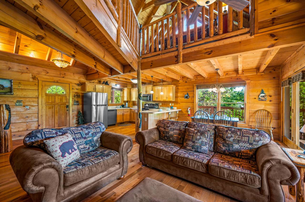 Living room with sleeper sofa, arm chair, gas fireplace, & TV Living room with sleeper sofa, arm chair, gas fireplace, & TV