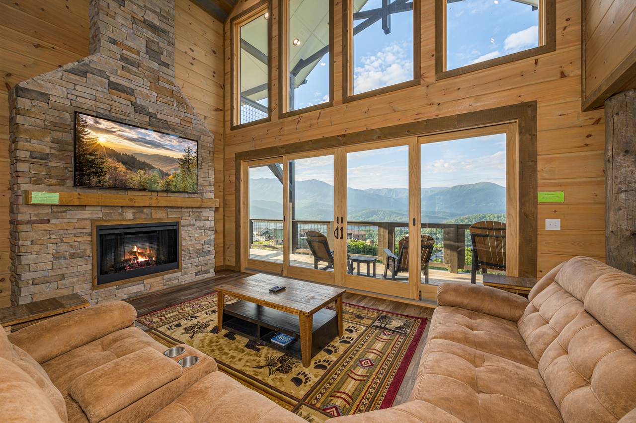 Spacious living room with views, sectional sofa, fireplace & TV Spacious living room with views, sectional sofa, fireplace & TV