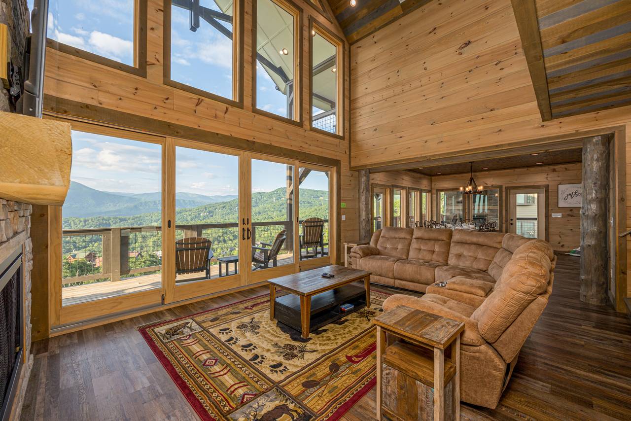 Spacious living room with views, sectional sofa, fireplace & TV Spacious living room with views, sectional sofa, fireplace & TV