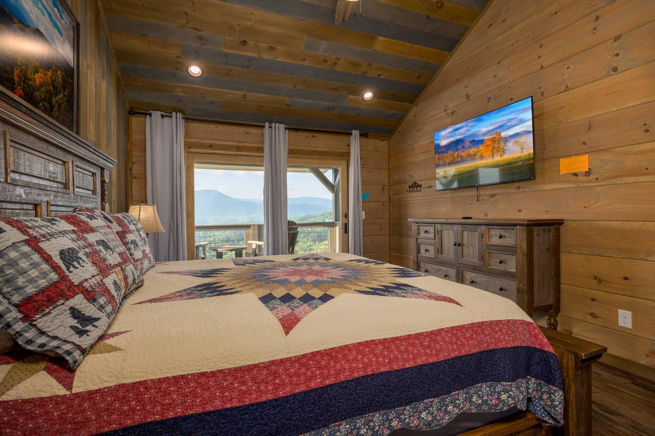 Bed 2: upper level, king with deck access, TV, & ensuite full ba Bed 2: upper level, king with deck access, TV, & ensuite full ba