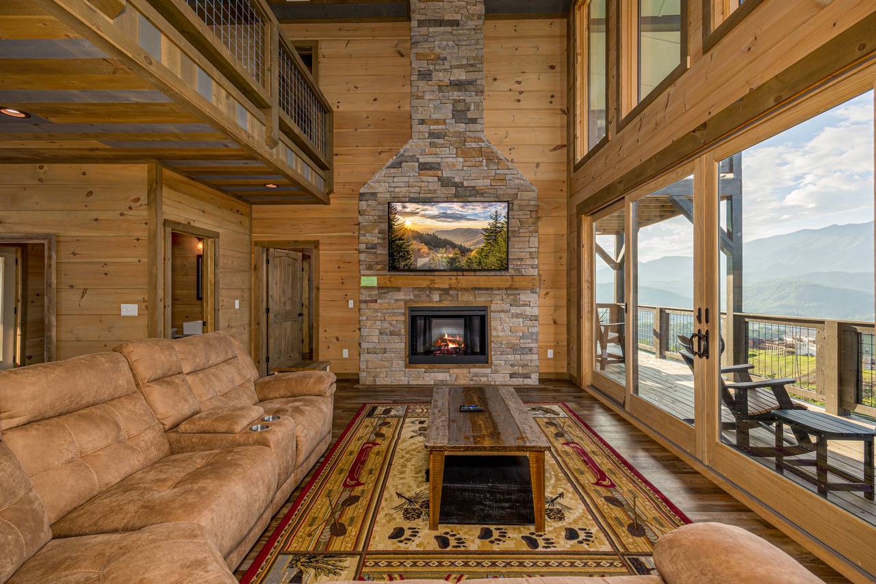 Spacious living room with views, sectional sofa, fireplace & TV Spacious living room with views, sectional sofa, fireplace & TV