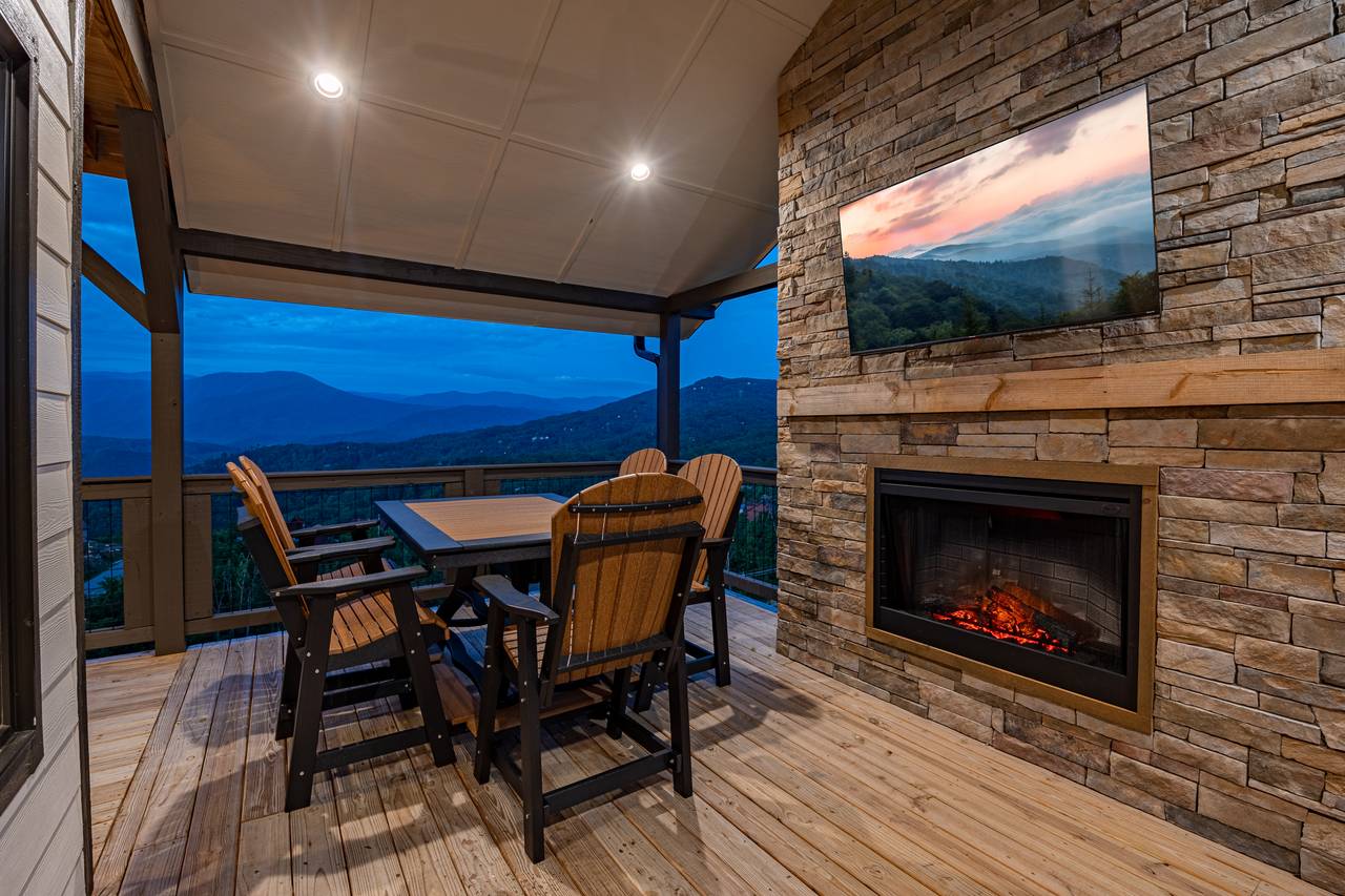 Outdoor fireplace, dining, and TV for entertainment. Outdoor fireplace, dining, and TV for entertainment.