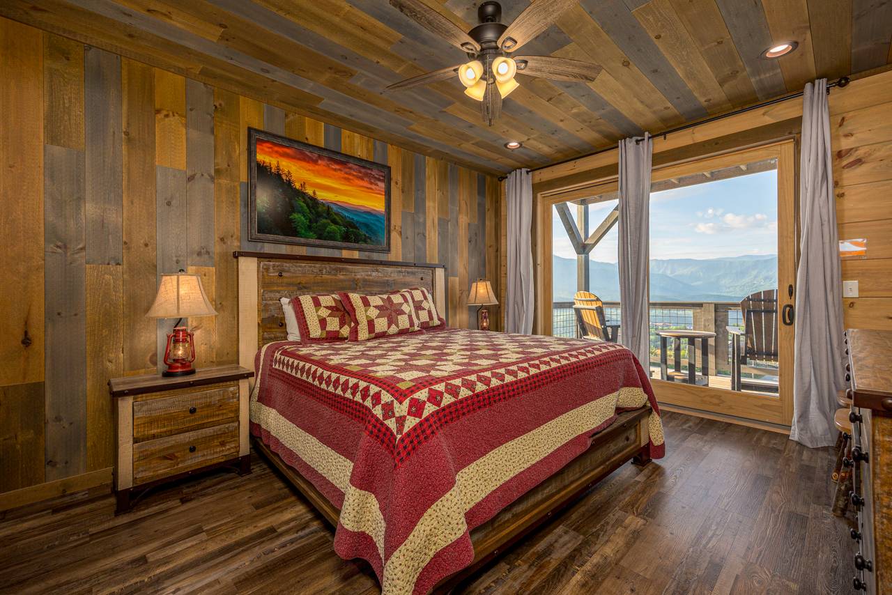 Bed 1: Entry level king with deck access, TV, & ensuite full bat Bed 1: Entry level king with deck access, TV, & ensuite full bat