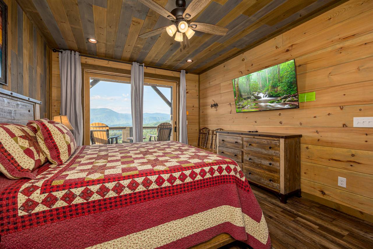 Bed 1: Entry level king with deck access, TV, & ensuite full bat Bed 1: Entry level king with deck access, TV, & ensuite full bat
