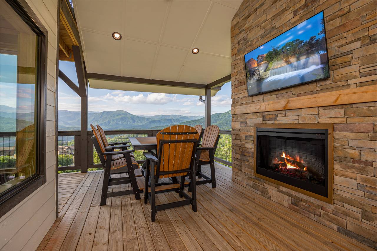 Outdoor fireplace, dining, and TV for entertainment. Outdoor fireplace, dining, and TV for entertainment.