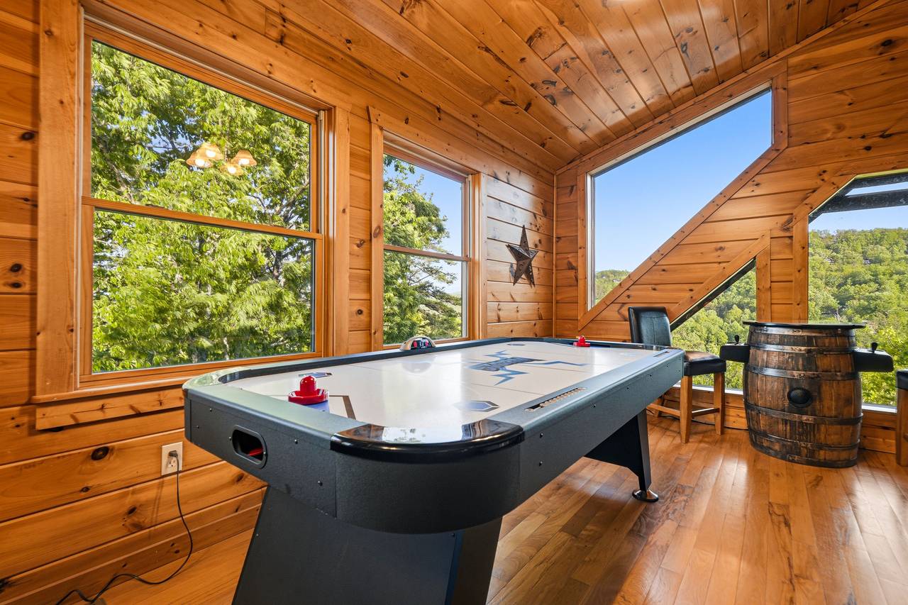 Upper loft game room with air hockey & arcade Upper loft game room with air hockey & arcade