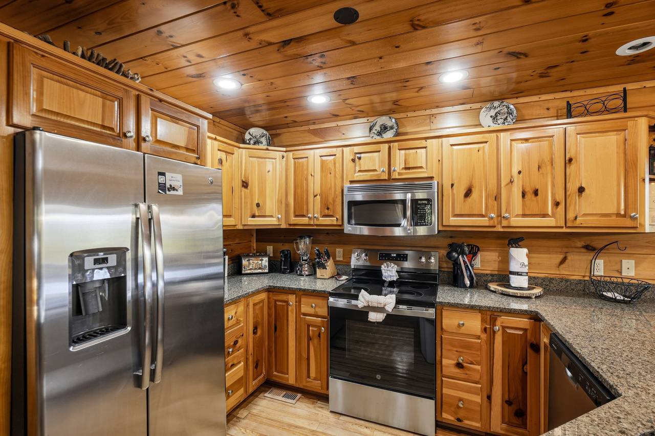 Kitchen with stainless appliances & bar seating for 4 Kitchen with stainless appliances & bar seating for 4
