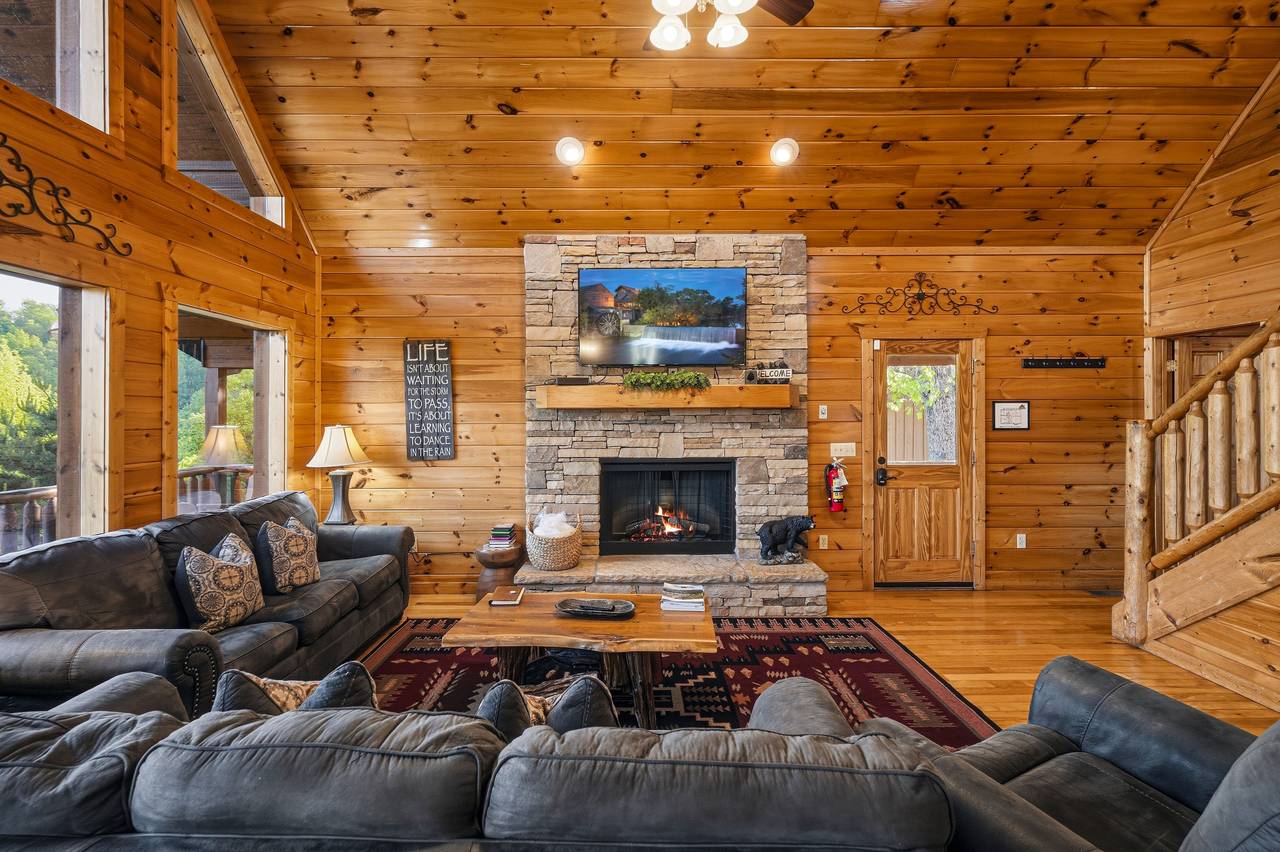 Open-concept living area with vaulted ceilings Open-concept living area with vaulted ceilings