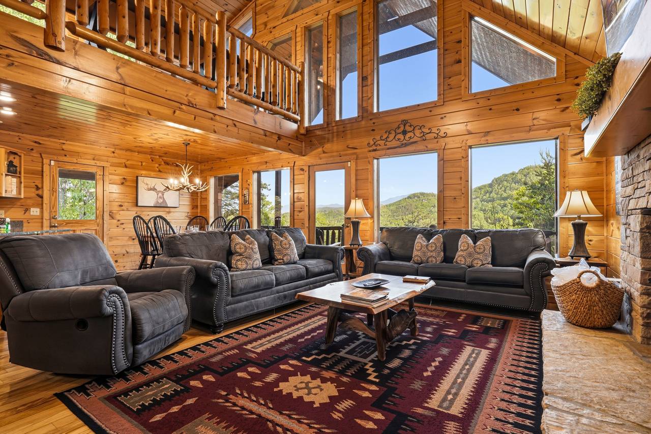 Main level living room with leather seating & fireplace Main level living room with leather seating & fireplace