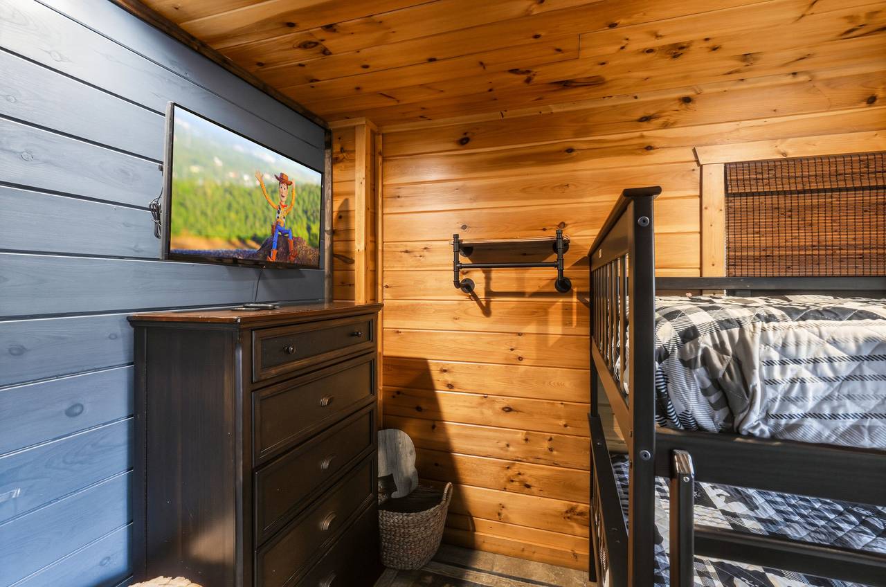 Bunk bedroom with full-over-full beds & TV Bunk bedroom with full-over-full beds & TV