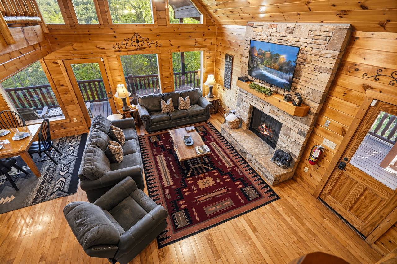 Open-concept living area with vaulted ceilings Open-concept living area with vaulted ceilings