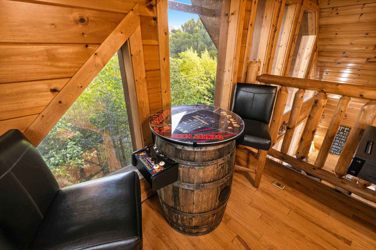 Barrel arcade machine in loft game room Barrel arcade machine in loft game room