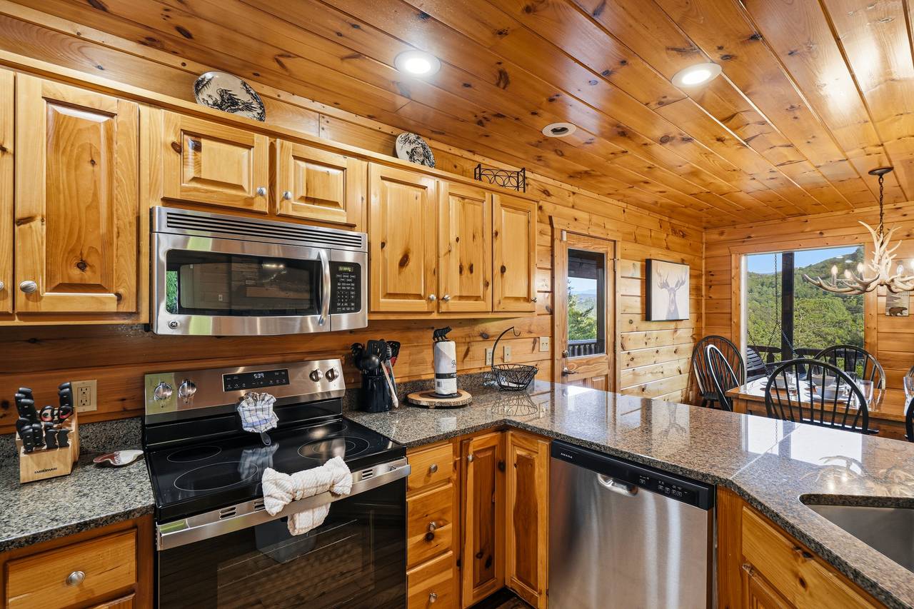 Kitchen with stainless appliances & bar seating for 4 Kitchen with stainless appliances & bar seating for 4