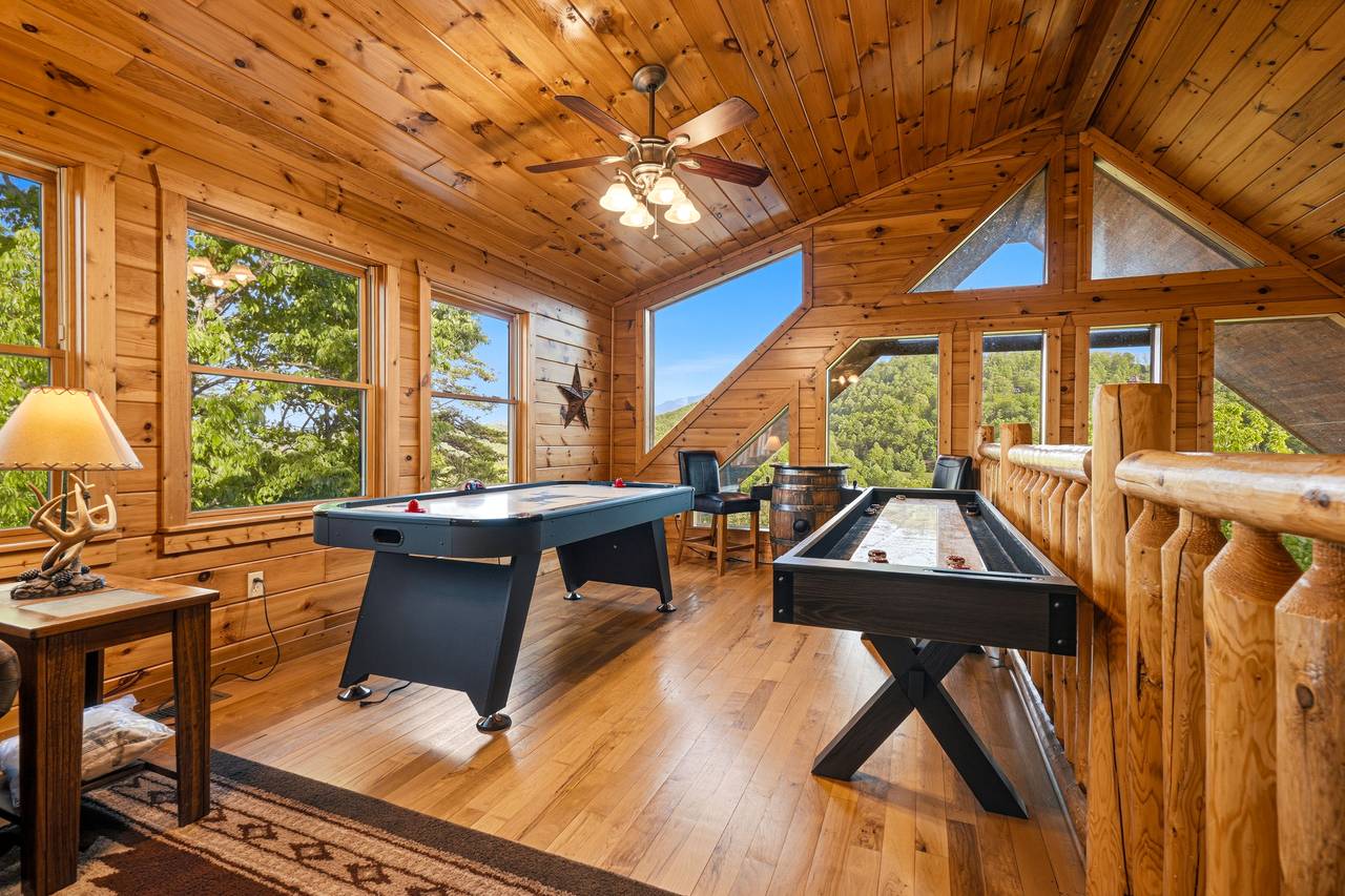 Upper loft game room with air hockey & arcade Upper loft game room with air hockey & arcade
