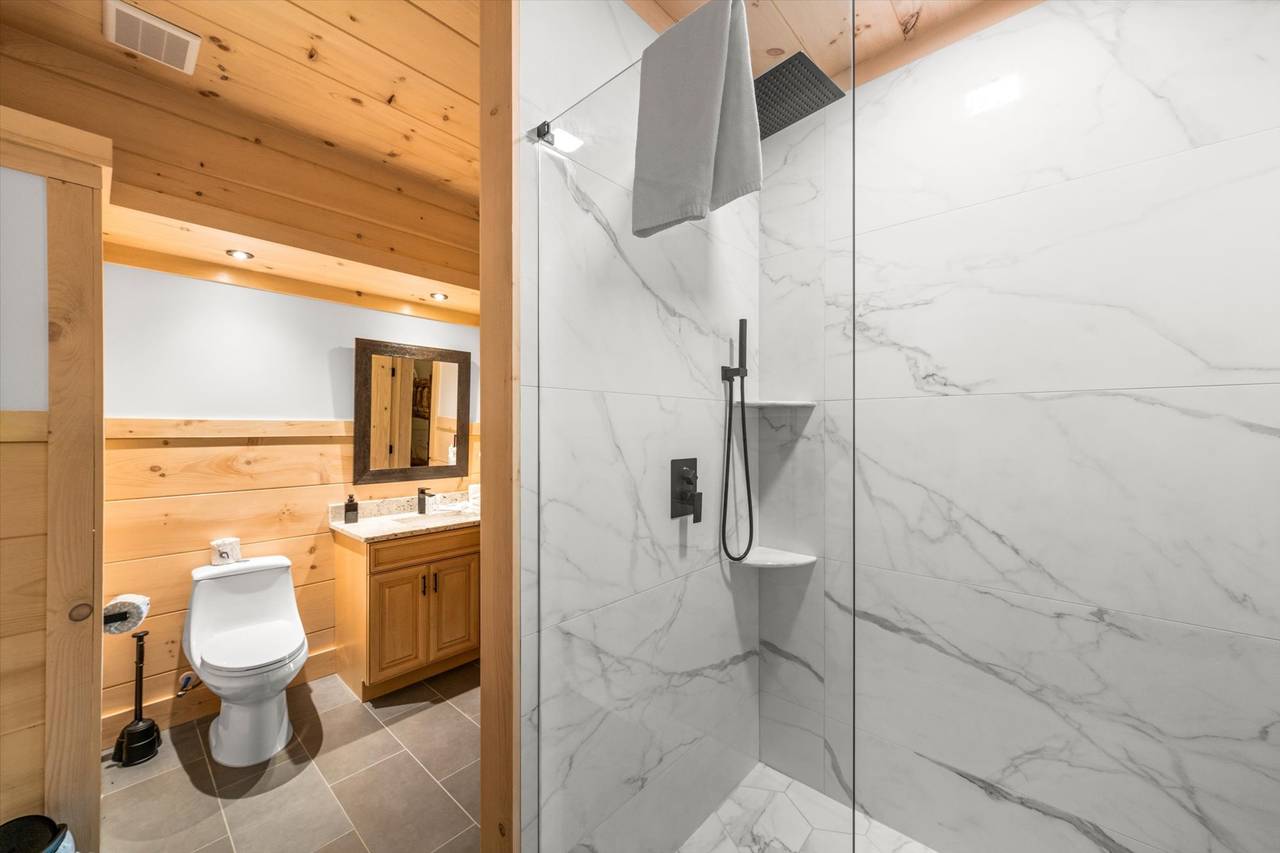 Bath 6: lower level full bath with standing shower Bath 6: lower level full bath with standing shower
