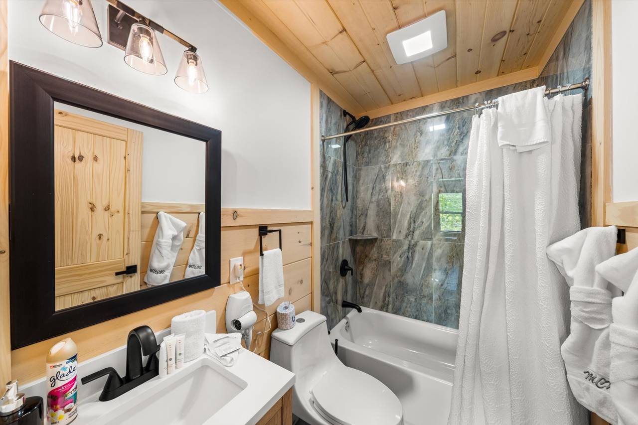 Bath 4: upper level queen with tub and shower combo Bath 4: upper level queen with tub and shower combo