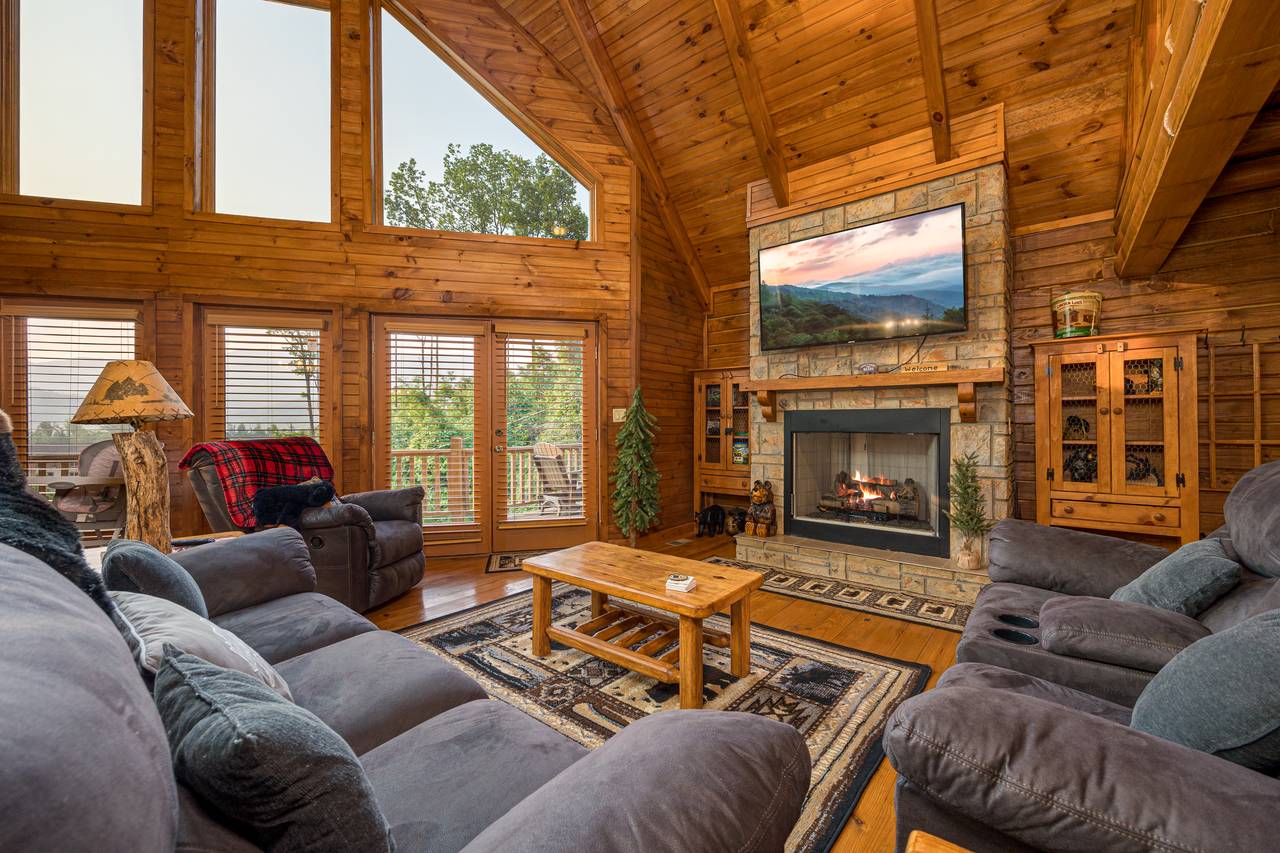 Living room with fireplace, comfy seating, and TV. Living room with fireplace, comfy seating, and TV.