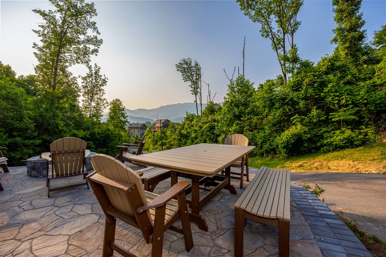 Outdoor space with a view, firepit, picnic table, & lounge chair Outdoor space with a view, firepit, picnic table, & lounge chair