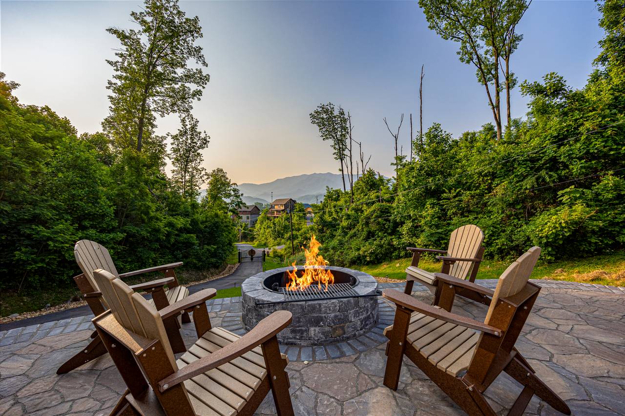 Outdoor space with a view, firepit, picnic table, & lounge chair Outdoor space with a view, firepit, picnic table, & lounge chair