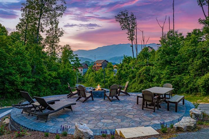 Outdoor space with a view, firepit, picnic table, & lounge chair Outdoor space with a view, firepit, picnic table, & lounge chair
