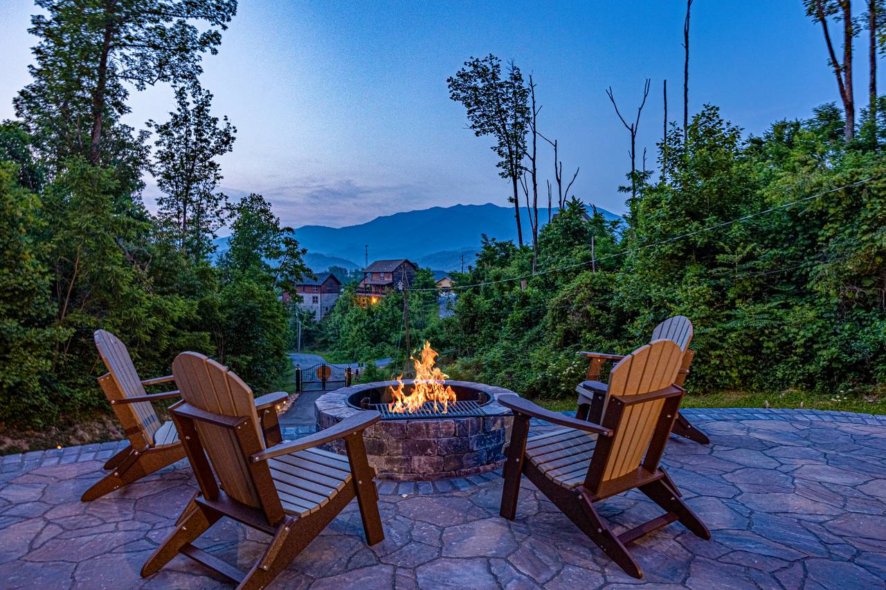 Outdoor space with a view, firepit, picnic table, & lounge chair Outdoor space with a view, firepit, picnic table, & lounge chair