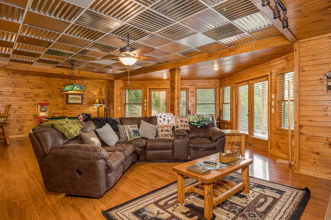Lower level media room with sofa, TV, and pool table Lower level media room with sofa, TV, and pool table