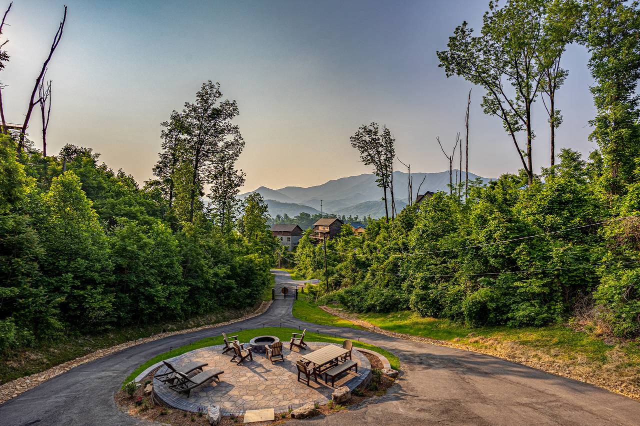 Outdoor space with a view, firepit, picnic table, & lounge chair Outdoor space with a view, firepit, picnic table, & lounge chair